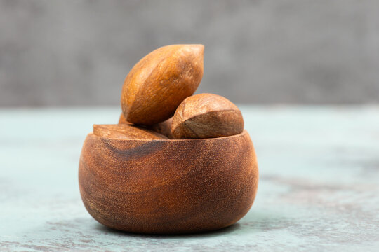 Peanuts in a wooden bowl, healthy nuts food, nutrition, ingredients for baking, protein and antioxidants