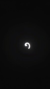 Glowing spiral line expands and rotates on a black digital field. Loading screen design, digital interface, and technology presentation.