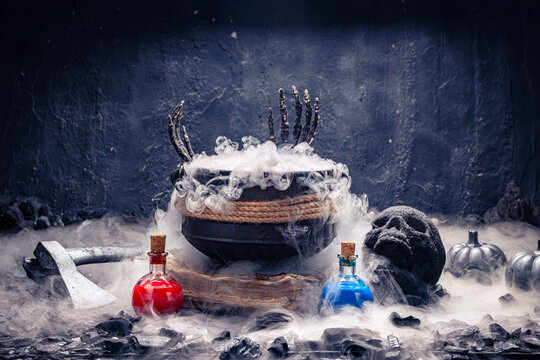 Witch cauldron in smoke with potions, skull, and axe