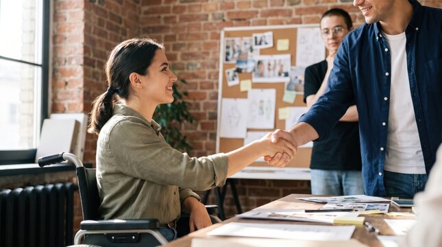 Woman shaking hands across table during office meeting with diverse colleagues, teamwork and professional collaboration in creative workplace environment