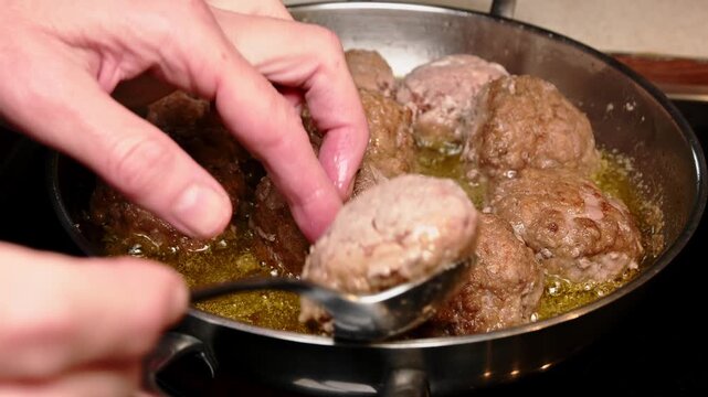 frying raw homemade minced meatballs in hot oil