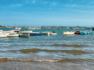 Small boats moored in Chichester Harbour at Emsworth, West Sussex, England © Nishi Sharma