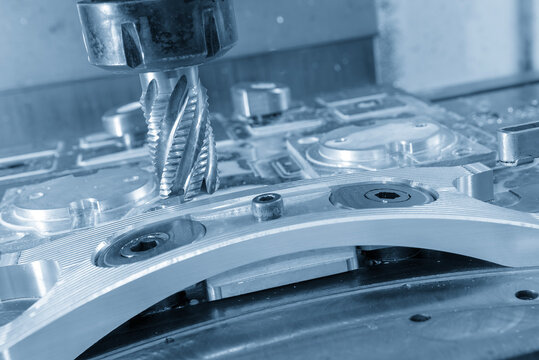 Inclined view of the rough cutting process on aluminum automotive parts using a wave edge cutter in a light blue scene