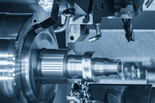 High-precision metal parts manufacturing on a multi-tasking CNC lathe machine in a blue tone scene