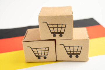 Germany flag with Shopping cart box, import export, finance commerce. © kanruthai