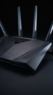 Modern Black High Speed Wi-Fi Gaming Router On Dark Surface
