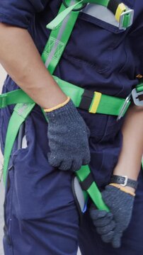 Engineers wearing harness safety climbing up the chimney to check and measure carbon dioxide levels or for air pollution reduction, continues emission monitoring system. Sustainable Environment. ESG