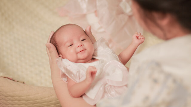 Maternal love, bonding, intimacy and family tenderness. Close up of a mother gazing affectionately at her newborn baby, highlighting their face to face connection in soft natural light.