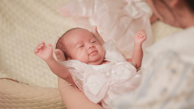 Maternal love, bonding, intimacy and family tenderness. Close up of a mother gazing affectionately at her newborn baby, highlighting their face to face connection in soft natural light.
