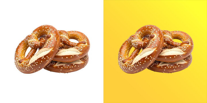 Two golden brown baked pretzels with coarse salt crystals, arranged together and isolated on a white background, for food concepts