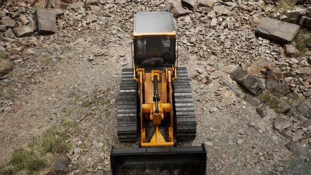 A powerful construction vehicle navigates through rocky terrain, showcasing its strength and capability.