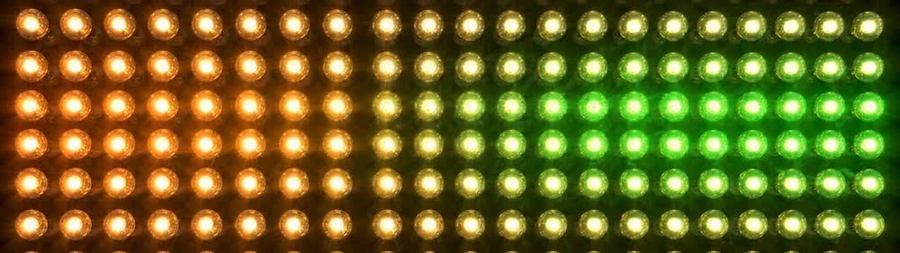 Rows of glowing bulbs forming a luminous horizontal pattern with repeated circular lights creating a bright decorative strip for banners and screens.