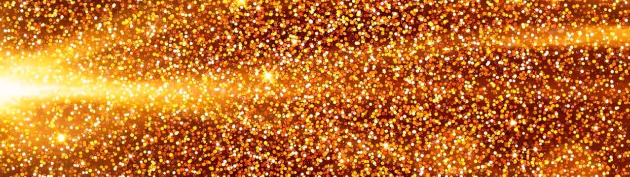 Gold glitter sparkling around a bright central glow creating a festive banner for celebrations invitations and luxury branding.
