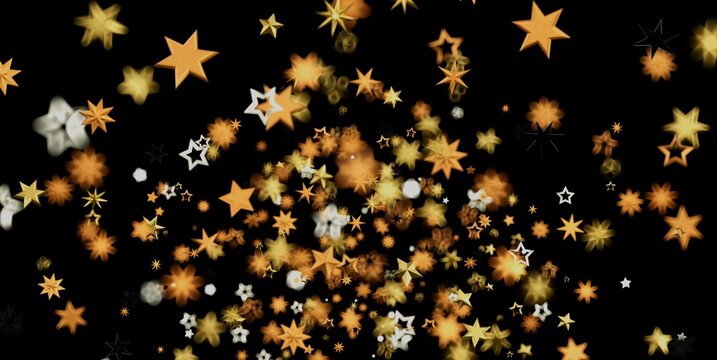 A shower of golden and white stars with bokeh effect on a dark backdrop.