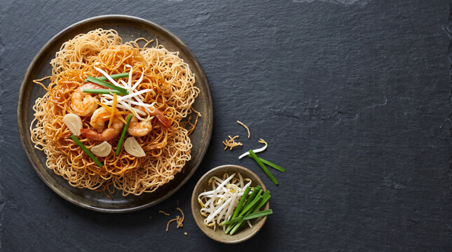 Thai mee krob crispy sweet and sour rice noodles, top view with copy space