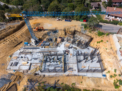 Aerial View Of Construction With Tower Crane And Concrete Foundation