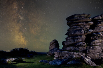 Bright Milky Way above rugged granite tors beneath a vast, star-filled night sky © worldimage