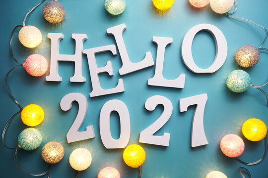 Hello 2027 alphabet letter with cotton ball LED decoration on blue background