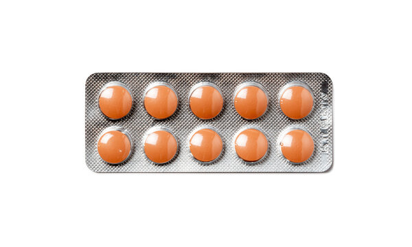Orange Round Pills in a Blister Pack Isolated on White Background