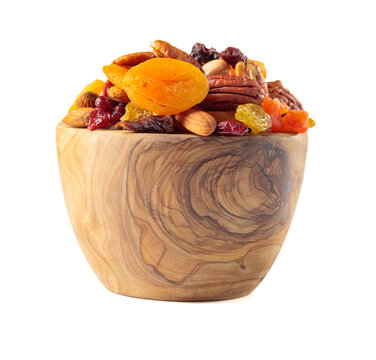 Assorted nuts and dried fruits isolated on a white background.