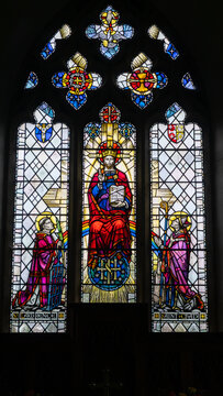 A stained-glass window depicting Christ and the saints in St. Lawrence Church