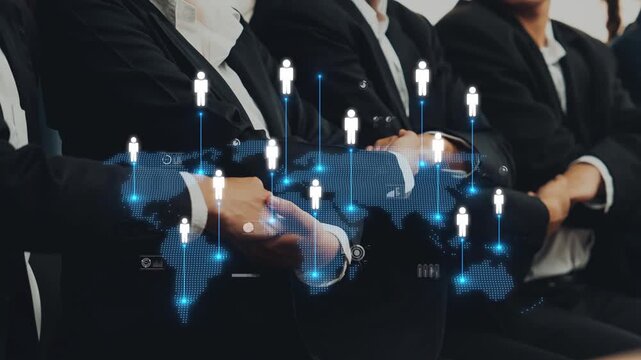 A group of business professionals in formal attire engaged in discussion, enhanced by a digital map and icons that represent global networking and collaboration in a corporate setting. Raster