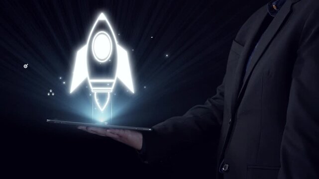 This image showcases a professional holding a tablet with a glowing rocket icon symbolizing growth and innovation in technology, set against a dark backdrop. Qubit