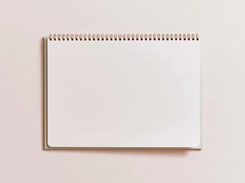 Blank spiral notepad with a smooth paper page on a soft lavender background, a clean mockup template for stationery and planner designs