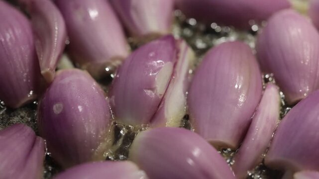 Stockholm, Sweden Shallot onions frying in a pan with butter. 
