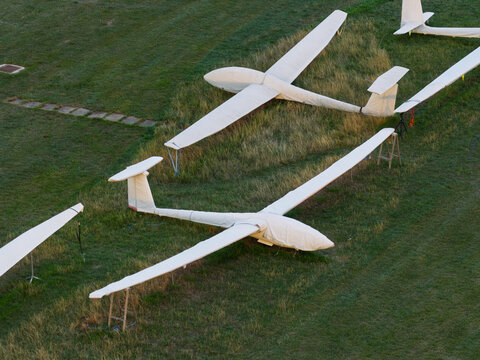White Gliders Parked on Green Grass