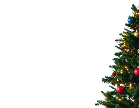 Decorated Christmas tree against a white background with ornaments
