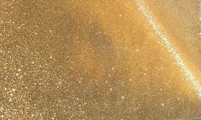 Elegant golden glitter background with shimmering bokeh effect, perfect for Christmas, New Year, and Thanksgiving holiday designs. Space for text . mardi gras concept © IULIIA