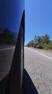 Side View of Car Wheel Driving Rural Road in Zamora