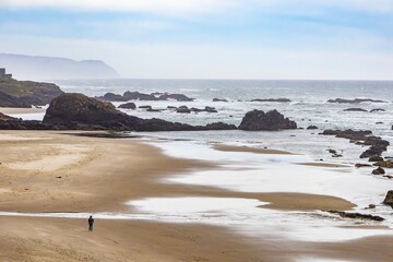 Person alone on dramatic west coast beach © Erin