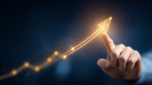 A hand touching the tip of a rising digital arrow illustrates business growth strategy and the pursuit of ambitious financial goals