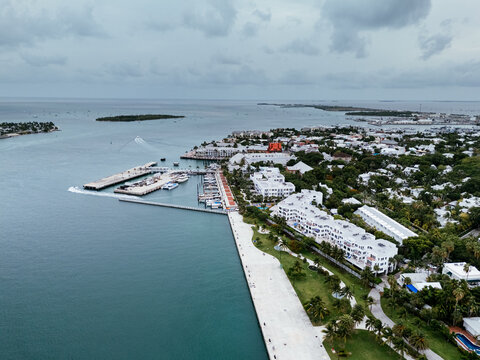 Key West, Florida, USA - view from airplane of waterfront, harbor, park, and ocean with a ship docked along the coast. g