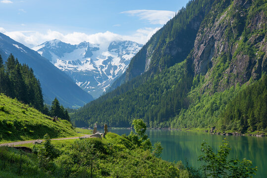 stunning spring landscape. Way along dam lake Stillup, Zillertal alps, called Wasserfallweg