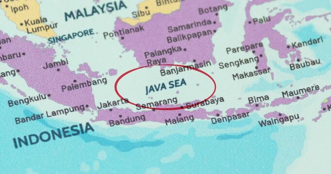 Detailed view of a red circle marking the java sea region on a modern political world map