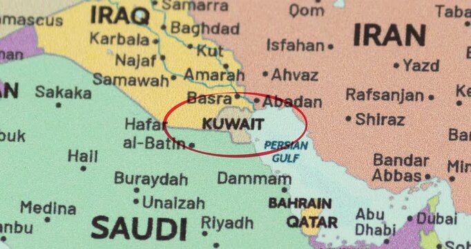 Detailed view of a red circle marking to kuwait on a modern political world map