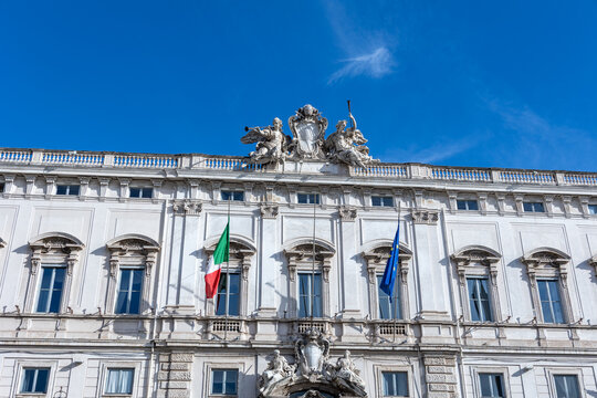 Palazzo della consulta facade in rome with italian and european union flags