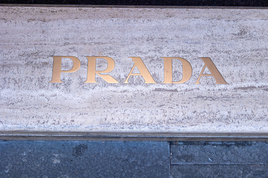 Luxury fashion lettering on a stone facade in rome