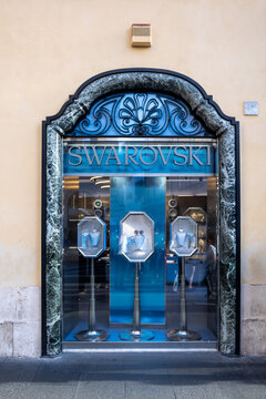 Luxury jewelry storefront with blue window display in rome, italy