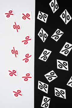Percent symbol on a black-and-white background. Loss or profit in business.

