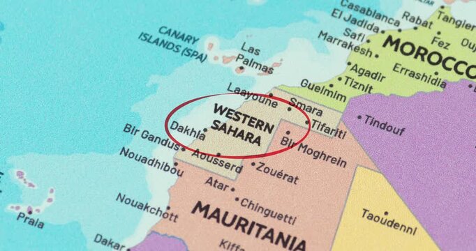 Detailed view of a red circle marking to western sahara on a modern political world map