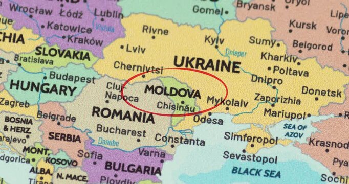 Detailed view of a red circle marking to moldova on a modern political world map
