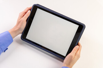 Tablet mock up with blank white screen held by hands on a light surface. white screen device isolated screen communication empty space frame mockup, internet touchpad inform © Kateryna Muzhevska