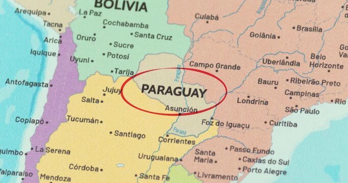 Detailed view of a red circle marking to paraguay on a modern political world map