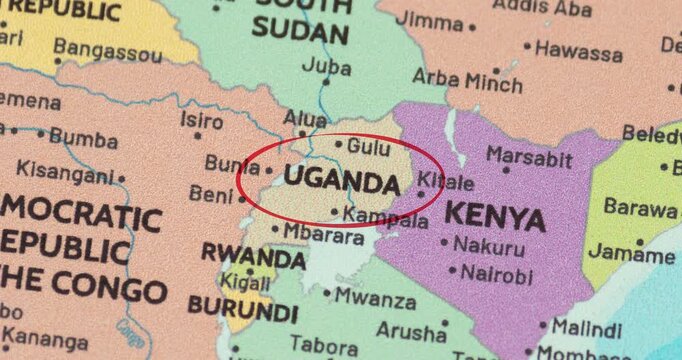 Detailed view of a red circle marking to uganda on a modern political world map