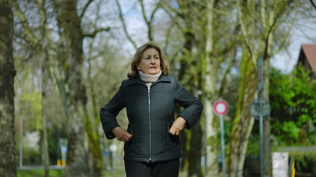 Caucasian senior woman enjoying fresh air in the park