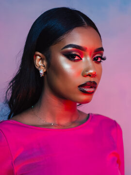 African American woman in pink clothing.